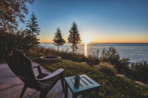 Adirondack style chair overlooking a beautiful sunset view